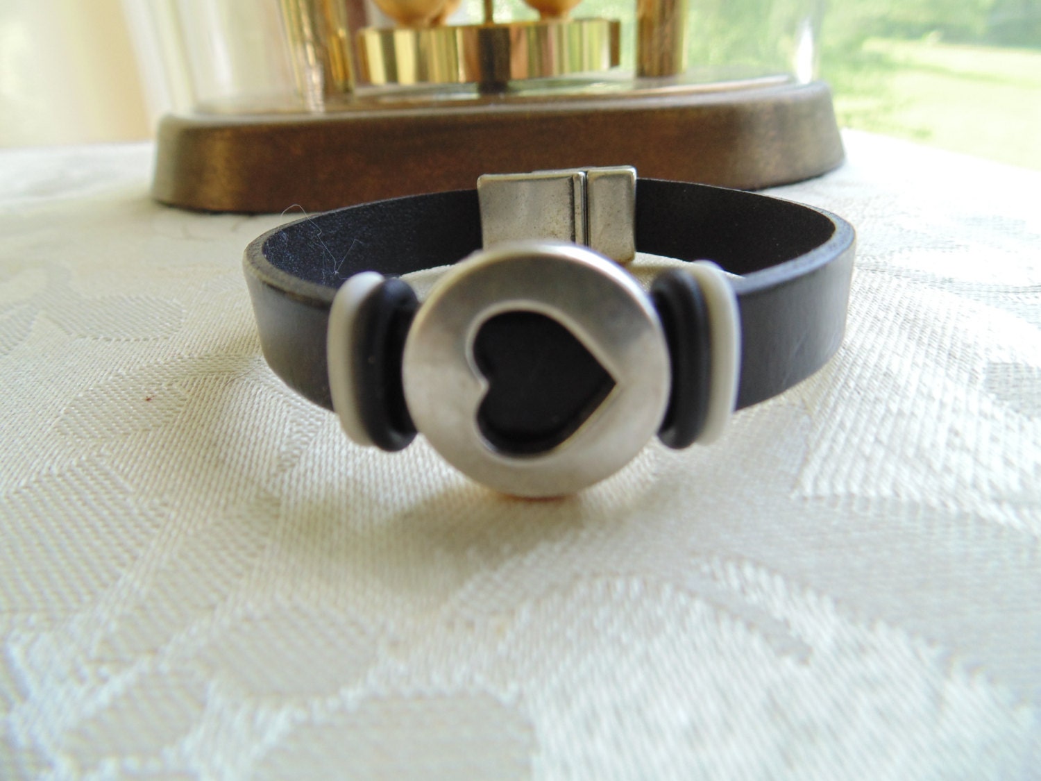 Black leather bracelet with heart slider