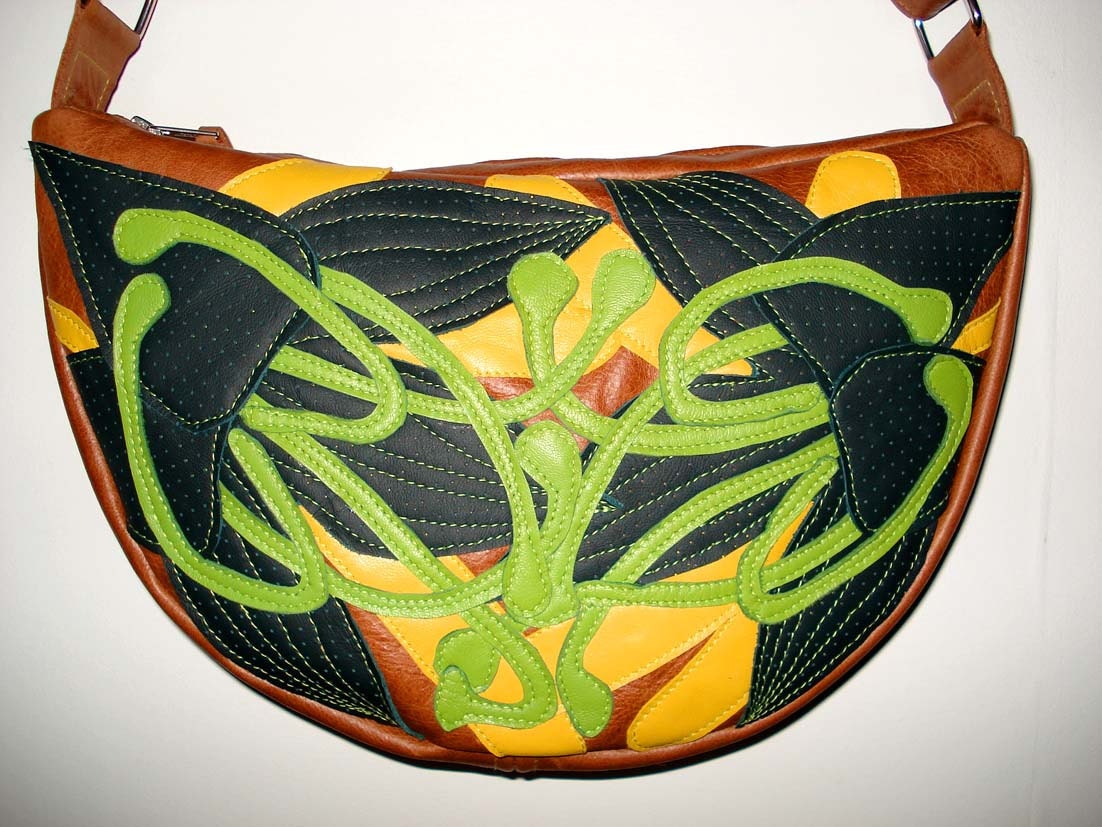 Handmade Crescent Bag in tan leather with perforated forest green appliqued Lilies