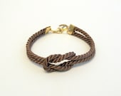 Brown knotted nautical rope bracelet with gold anchor charm