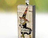 Wicked Witch pendant on upcycled domino