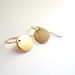 Gold circle earrings. Tiny brass discs on 14K gold fill GF ear wires. Dainty jewelry.