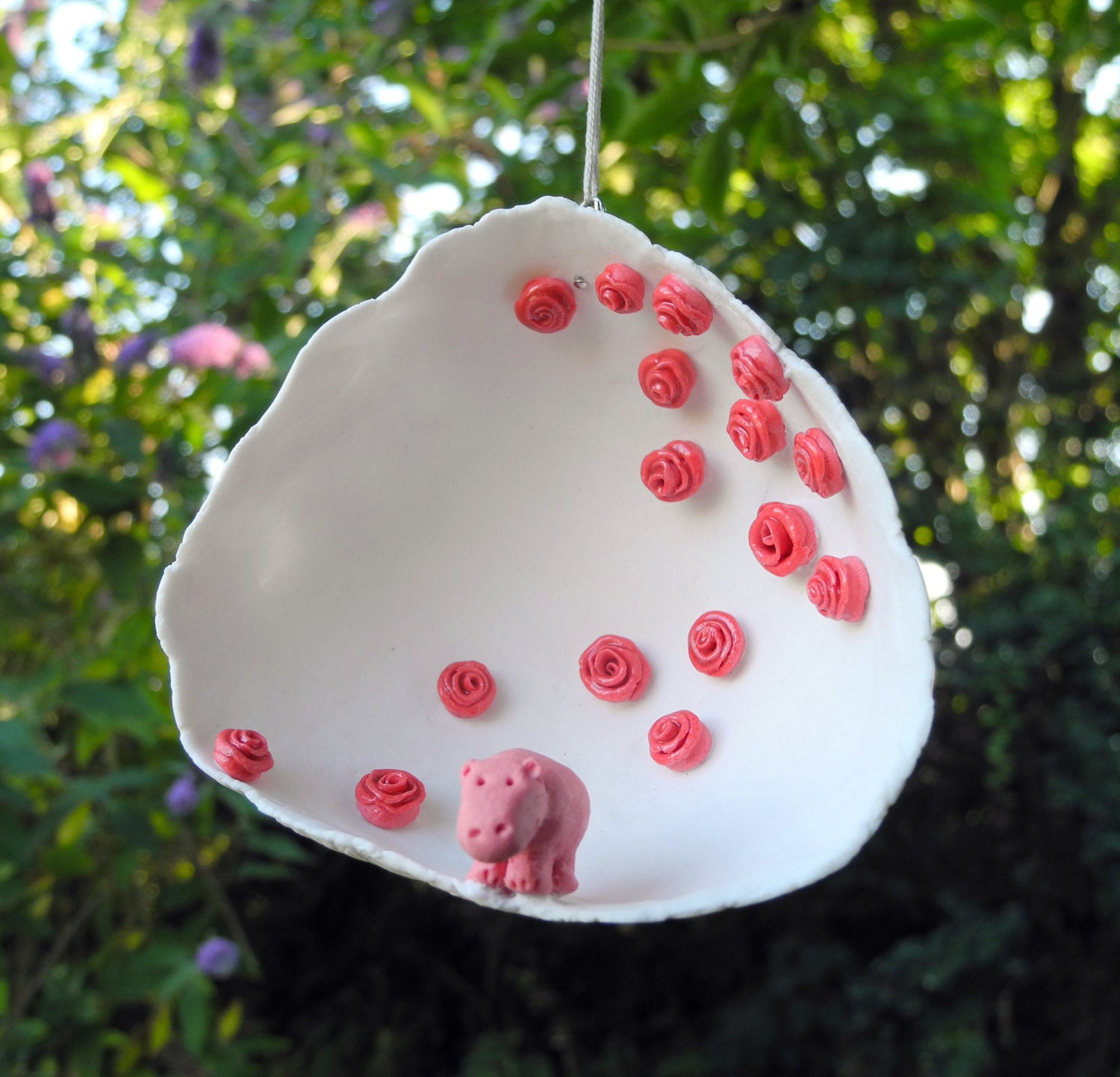 Hippo in a rose garden - porcelain decorative hanging.