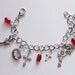 Demon Blooded - Supernatural themed charm bracelet with crystal and red beads
