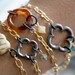 Arm Candy - small black quatrefoil clover flower with sea green bead charm gold chain bracele - gifts under 15
