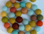 Meadow Garland -felt ball garland - in soft blues, browns and greens with orange accents - 6.5 ft long