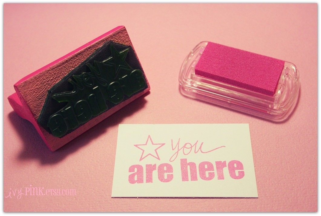 You Are Here Stamp on Pink Wooden Handle