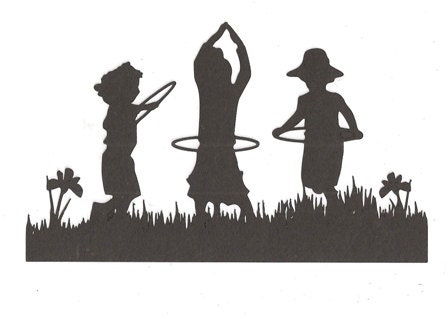 Children playing with hoola hoops silhouette