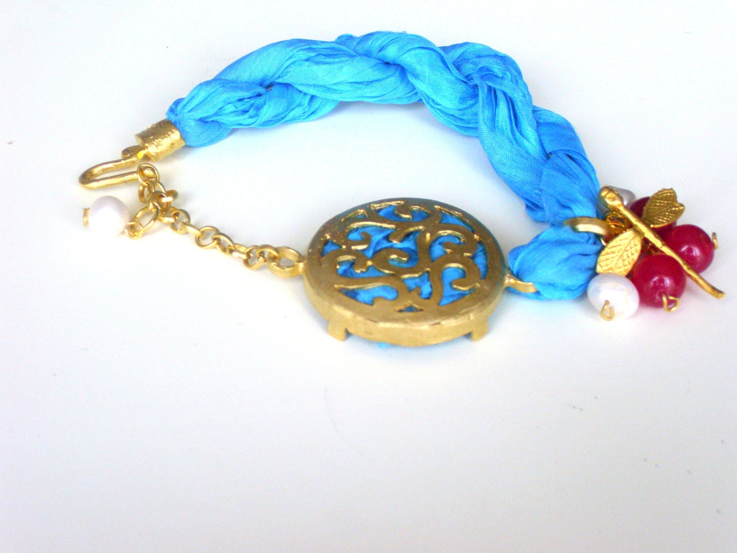 Turquoise silk bracelet with pink jade ,pearl and gold plated metal