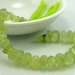 Glowing phrenite faceted nugget beads 8-13mm 1/2 strand