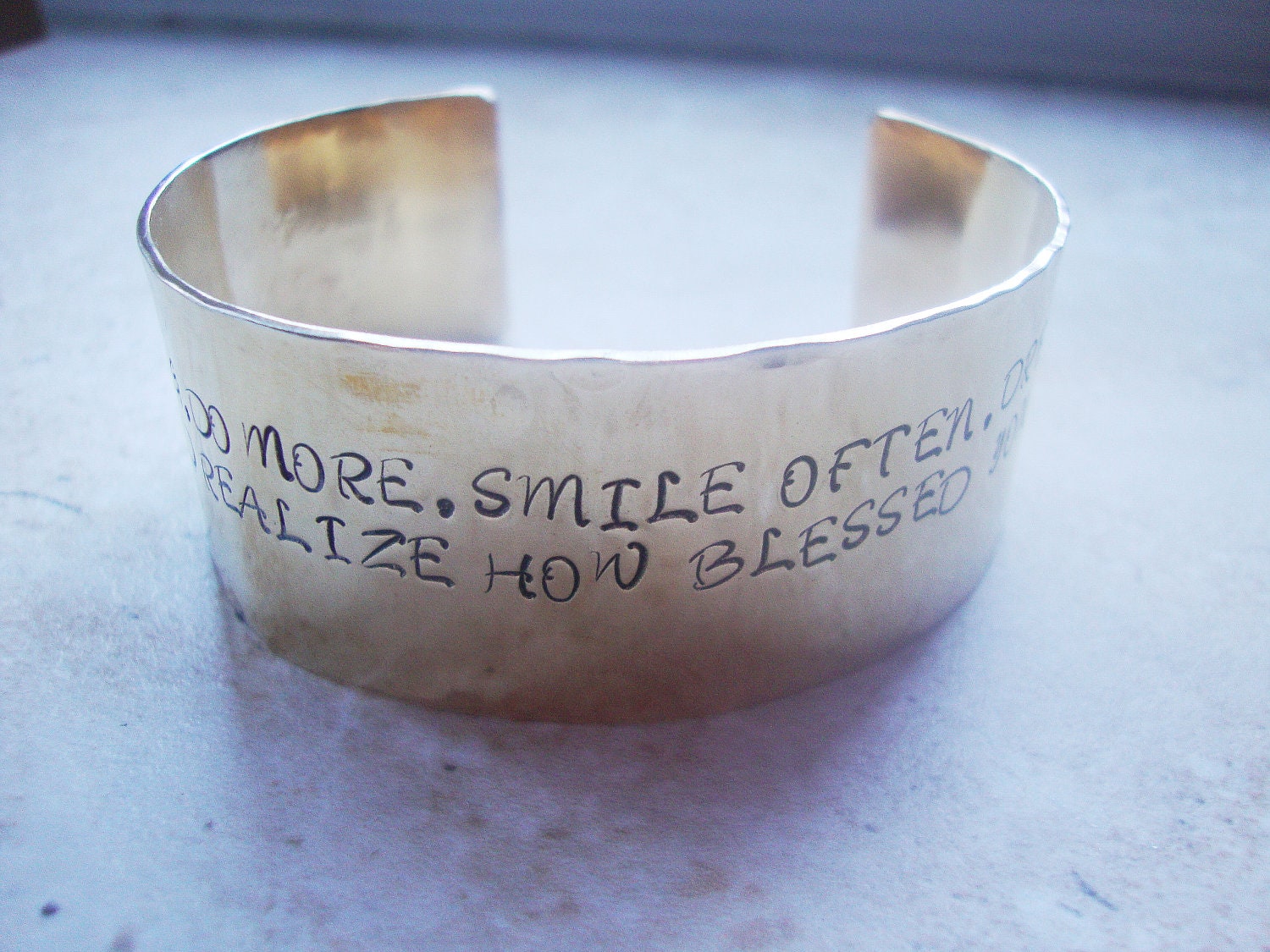 Wide brass statement cuff hand stamped with inspirational words
