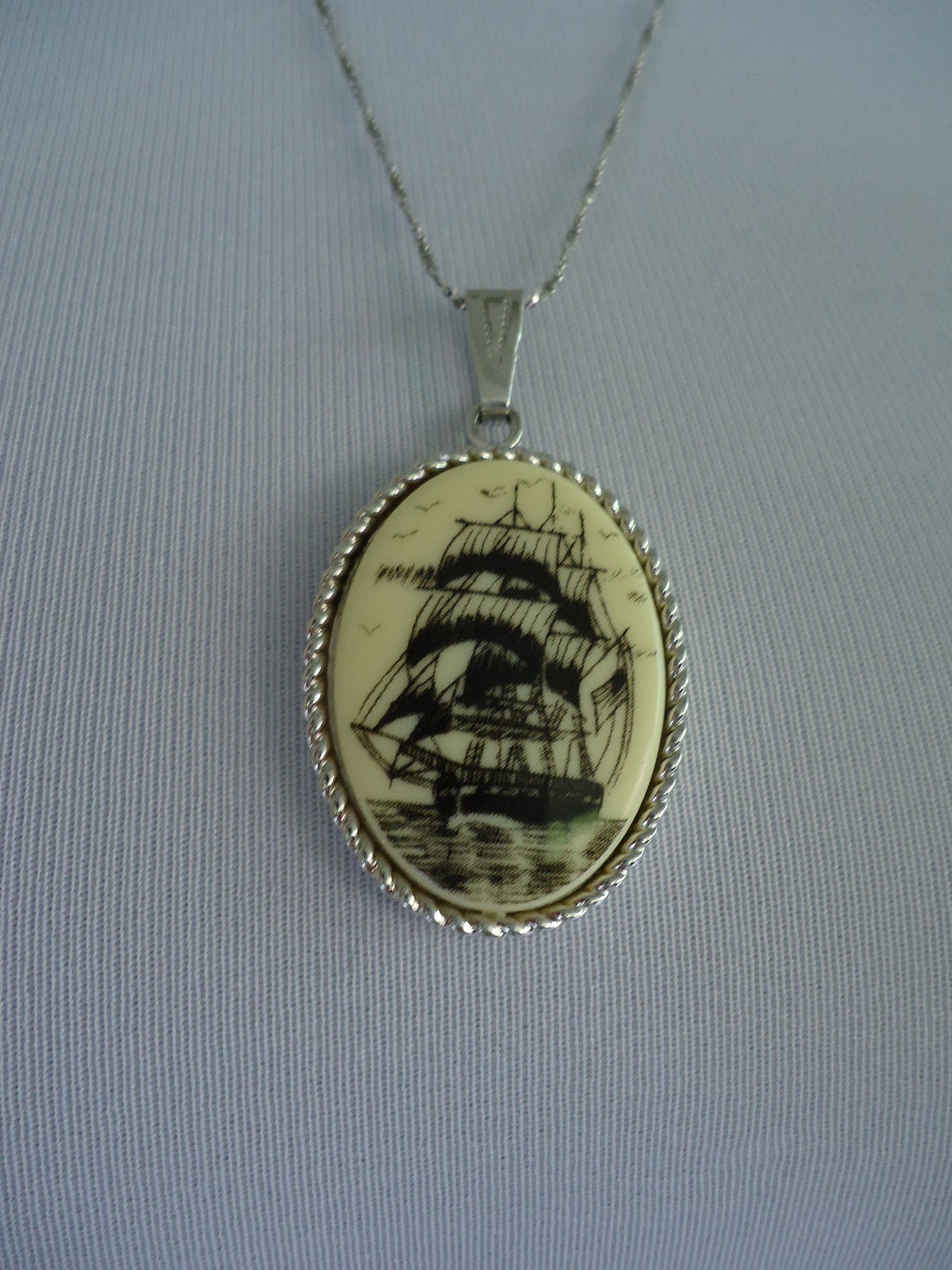 1970s pendant / 70s Sarah Coventry Faux Scrimshaw "Legend" Sailing Ship pendant