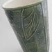 ceramic travel mug in green with leaves...