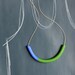 not quite a semi circle makes a necklace