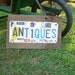 Recycled Barn Wood License Plate Art Sign - ANTIQUES