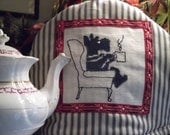 Teapot cosy, machine appliquéd. Blue and white cotton with scottie dog on chair with mug
