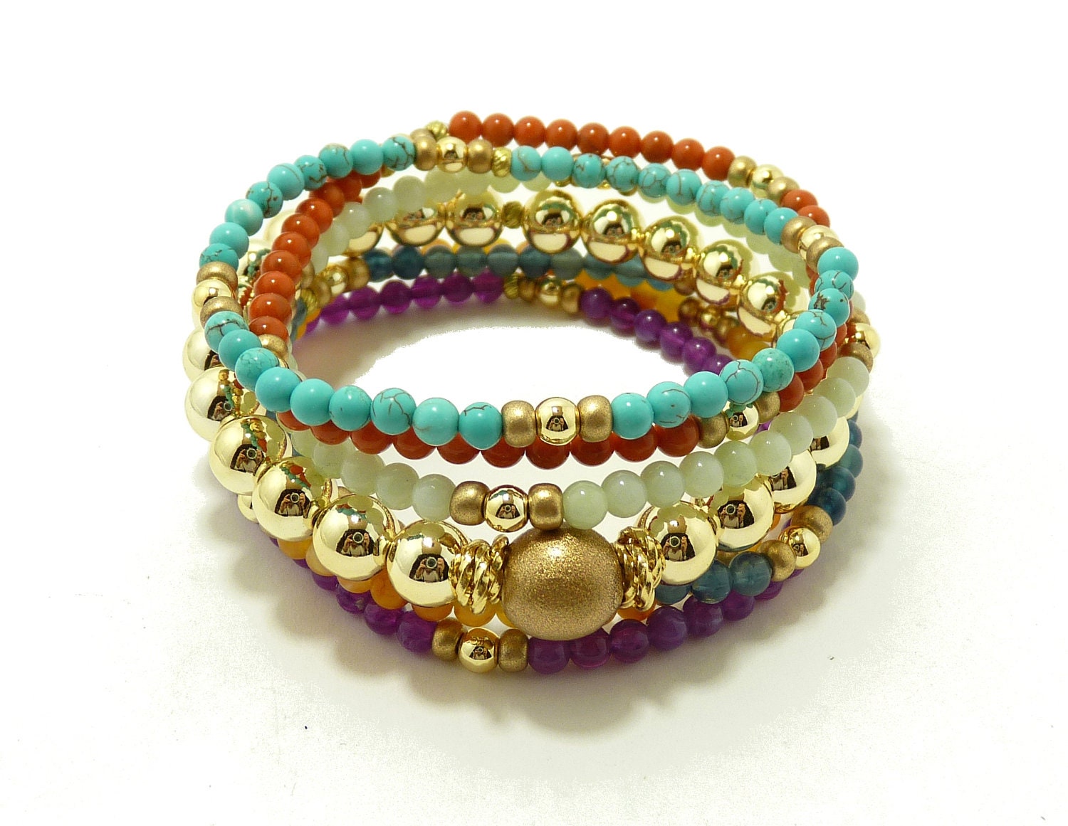 7 strand stretchable stack bracelets with rainbow color in gold. By Simply Uniq Fashion Bracelet.