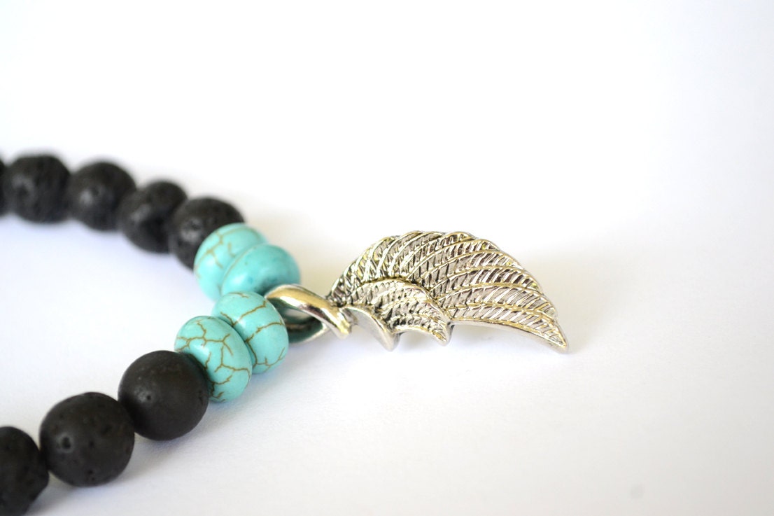 Black Lava Rock and Turquoise Howlite Stretch Bracelet with Angel Wing Charm