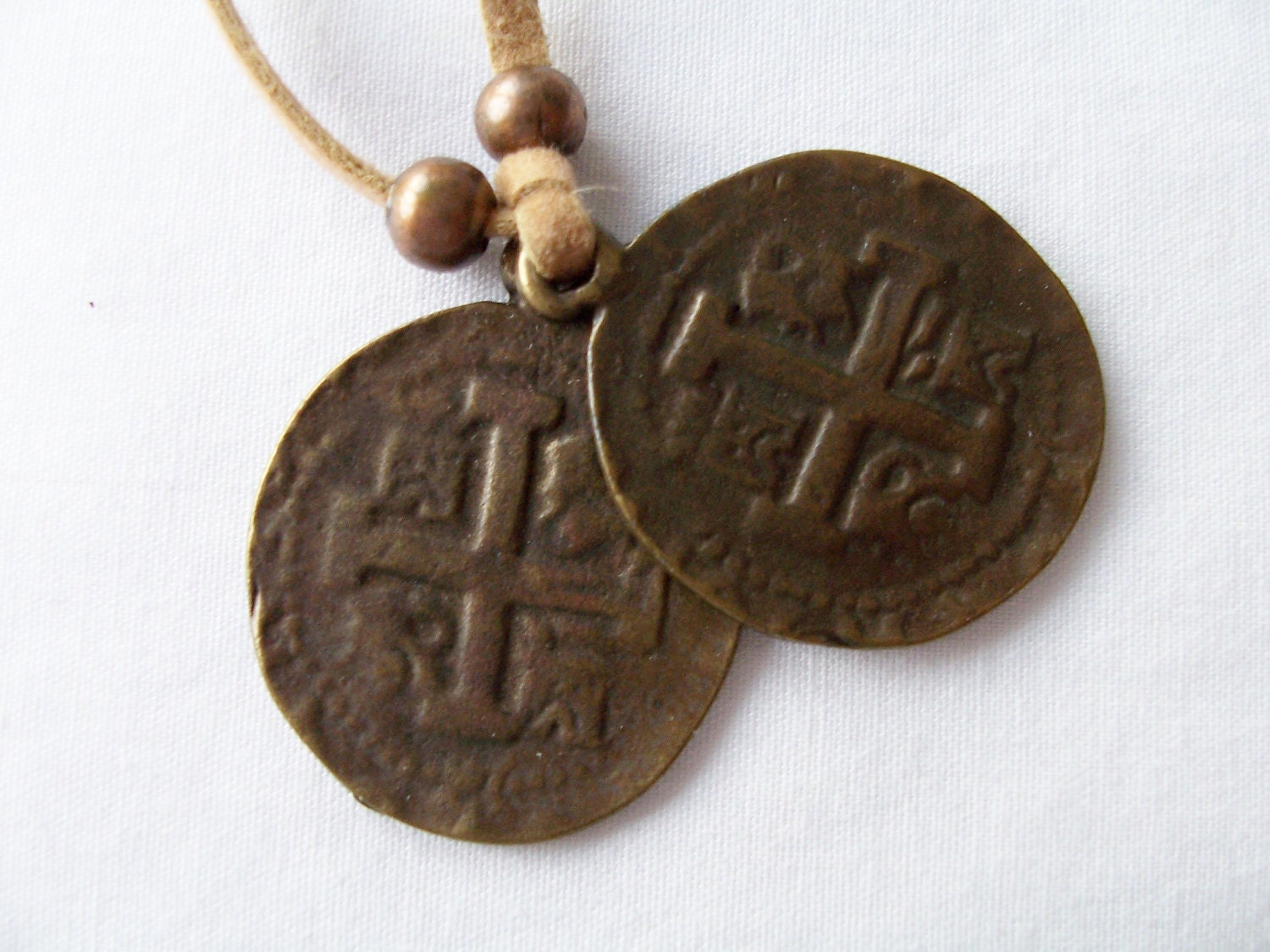 Old metal coins on faux suede cord - coin jewelry - coin necklace - symbolic pendant jewelry
