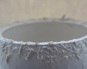 Unusual earthenware bowl with a unique textured rim.