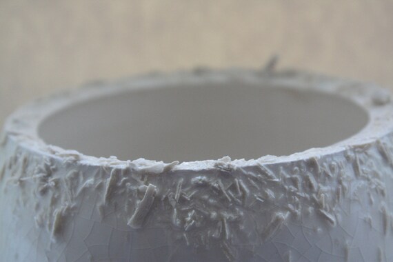 Unusual earthenware bowl with a unique textured rim.