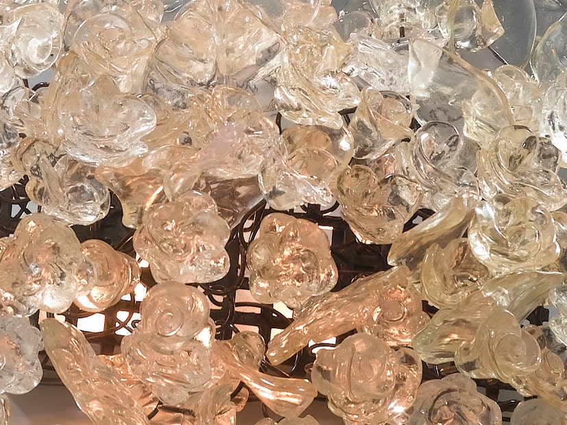 Wall light fixture. Transparent flowers and leaves.