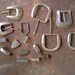 7 vintage WESTERN silver BELT BUCKLES & Extras: 1 tip, 1 embellishment, 7 belt 'keepers'
