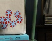 Geometric screen printed lunch bag recycled cotton hexagon pattern orange and light blue water based ink