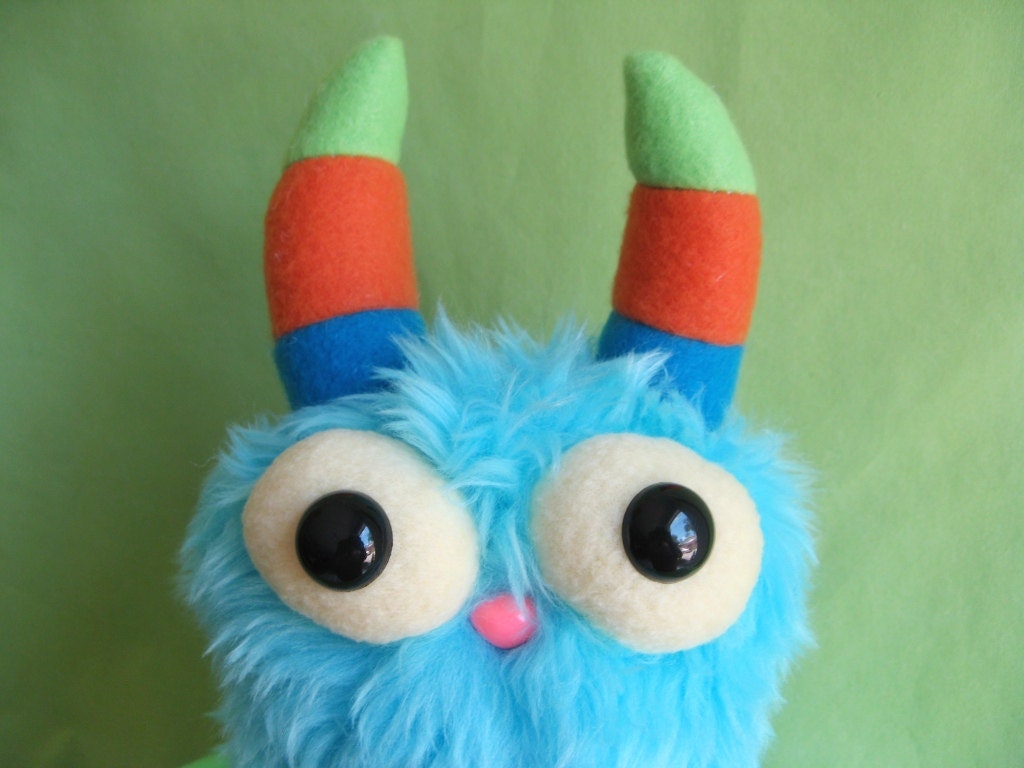 Monster toy stuffed animal plush with striped horns
