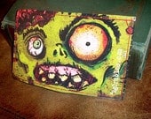 Green Zombie Face Vinyl Wallet by agorables Keepers of the Undead Creator of Monsters
