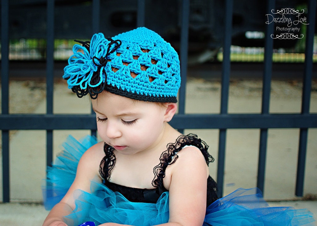 Crocheted Beanie with Frilly Loopy Flower Hot Blue, Black Trim Flowered Beanie Open Weave Design