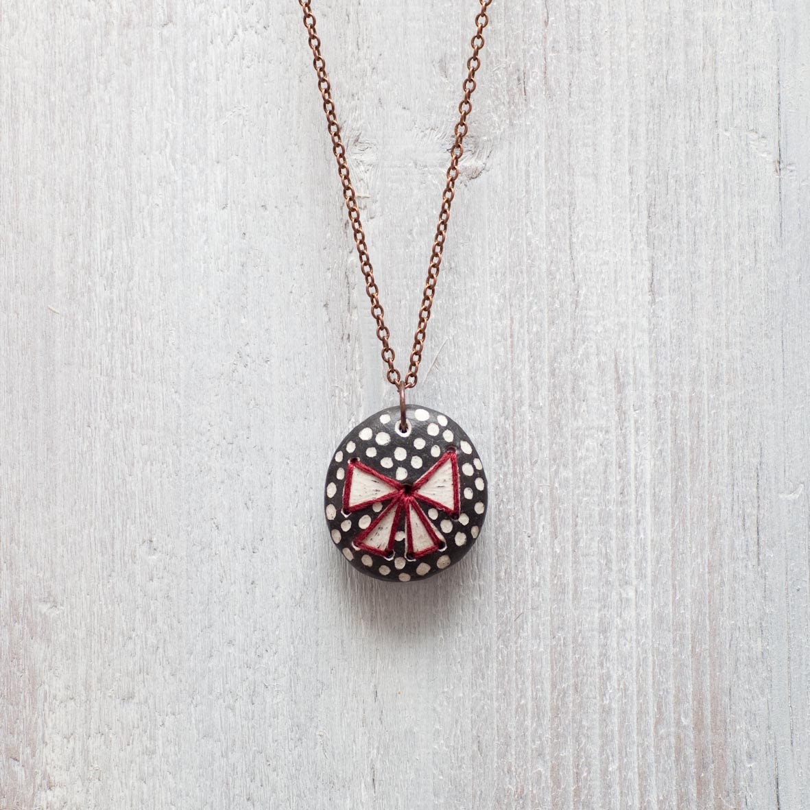 Pendant in ceramic. Embroidered Lace. OOAK