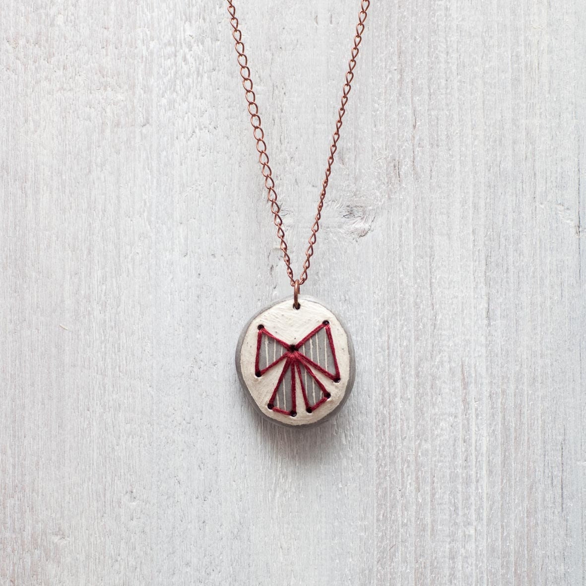Pendant in ceramic. Embroidered Lace. OOAK