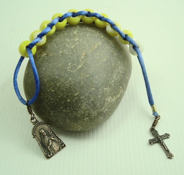St Therese Sacrifice Beads Yellow and White Swirl Opaque Glass Beads and Blue Cording
