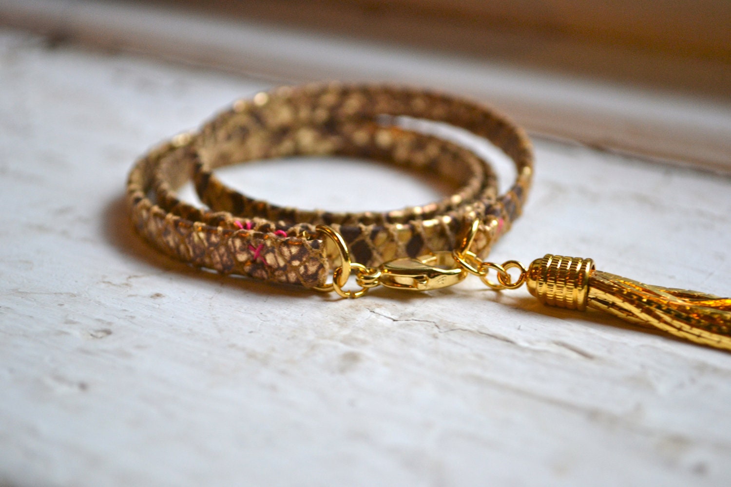 metallic gold and tan snakeskin genuine leather & gold triple wrap bracelet with tassel