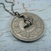 French franc coin with croissant charm, antique silver