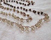 Brown crystal, shell, and mottled glass beaded long crocheted necklace