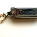 Harmonica necklace on gold chain... I've got the blues necklace