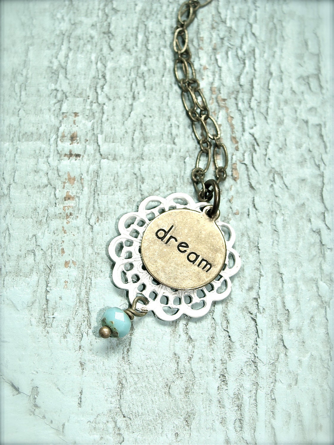 Dream.  Dainty inspiration necklace. Cream antique brass charm necklace with turquoise bead.