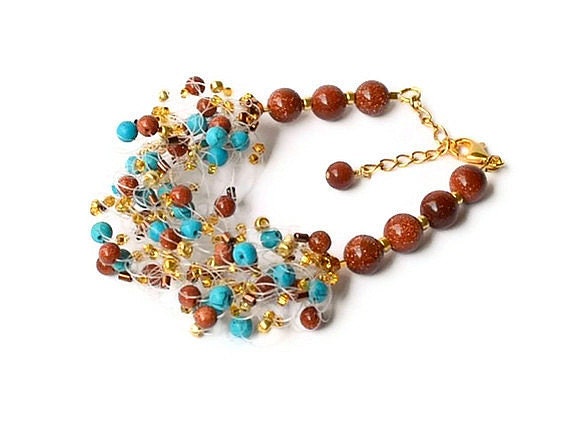 Airy crochet bracelet with turquoise and goldstone blue and brown country style