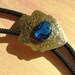 Mens Bolo Tie with Blue Abalone Cabochon on Vintage Gold Tone Arrowhead Concho