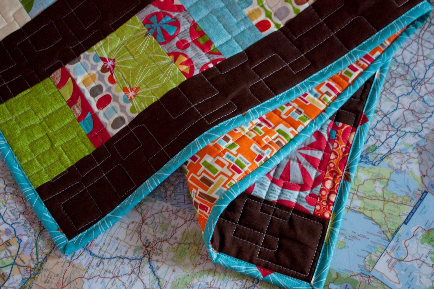 baby quilt in gender neutral fabrics // mod century // modern stacked coin quilt in bright shades