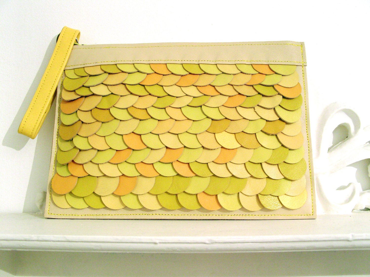 Cream and Yellow leather wristlet. Layers of delightful discs clutch bag with detachable strap.
