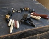 FERAL. Bobcat Back Bone Vertebra, Black tourmaline chunks, Czech glass and Jasper talon bracelet