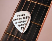 Hand stamped oxidized Guitar Pick / pendant - "Where words fail, music speaks"