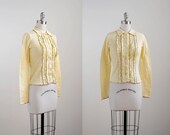 vintage 1970's yellow cardigan. 70's ruffle sweater. knit. black edge. small. pastel cardigan 70.