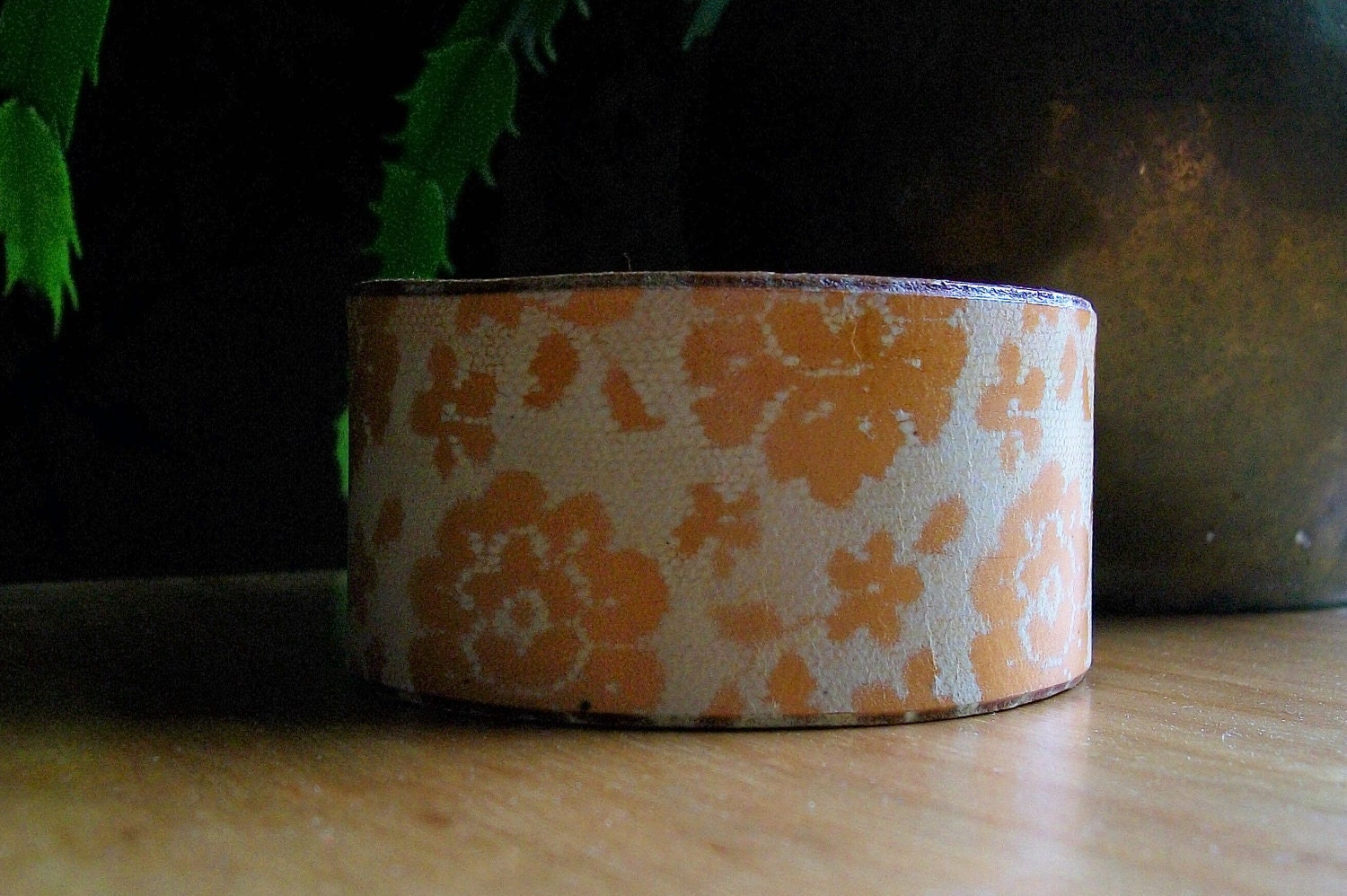 Lacy floral leather cuff in saddle tan