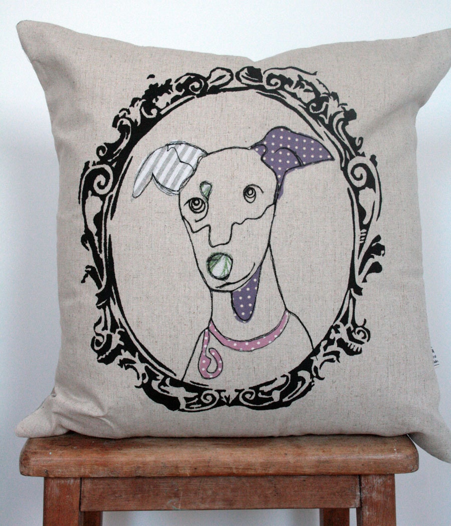 Appliqued dog cushion in frame
