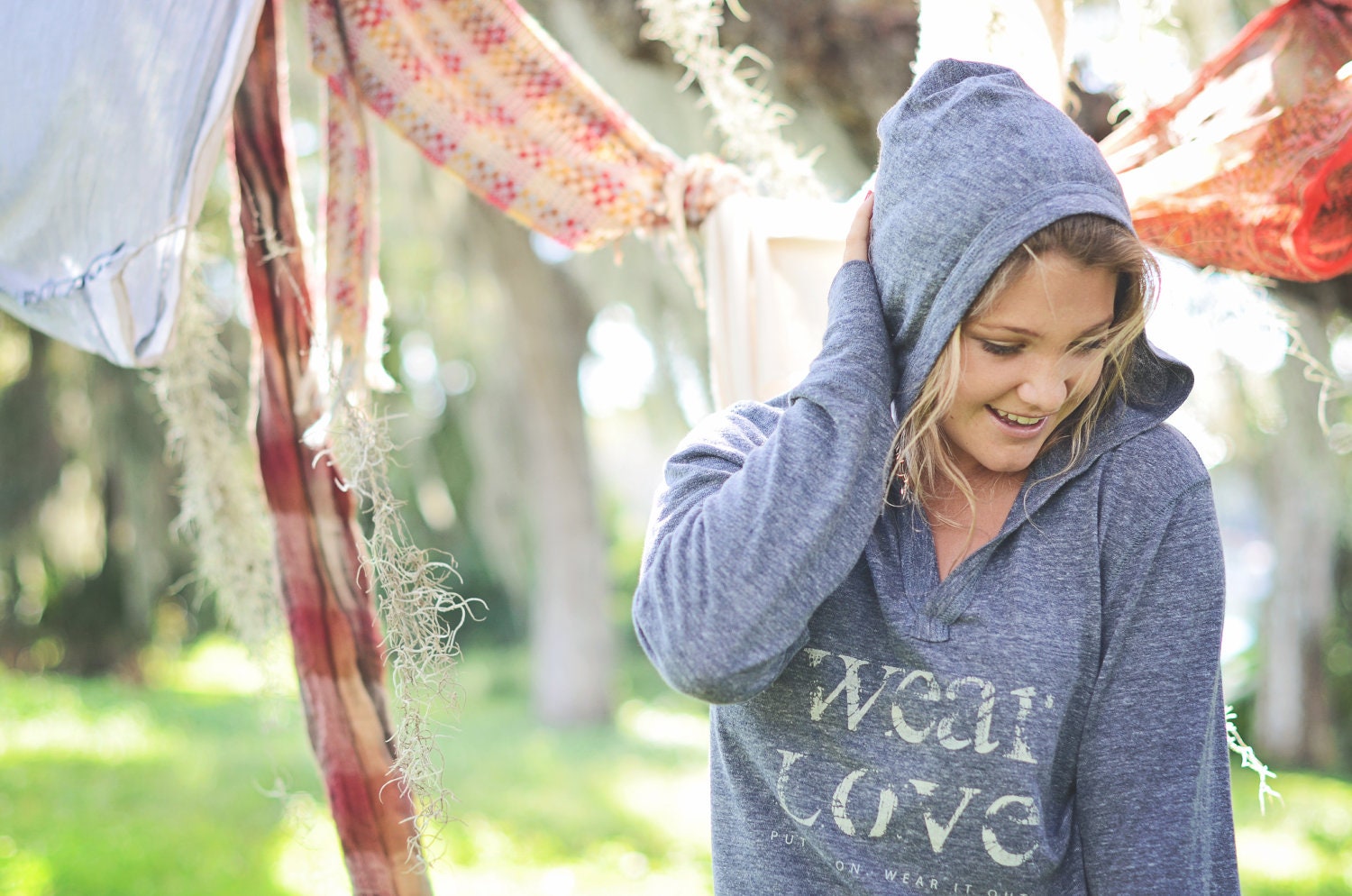 wear Love  put it on. wear it out.  small v neck long sleeve pullover hoodie in eco-navy.