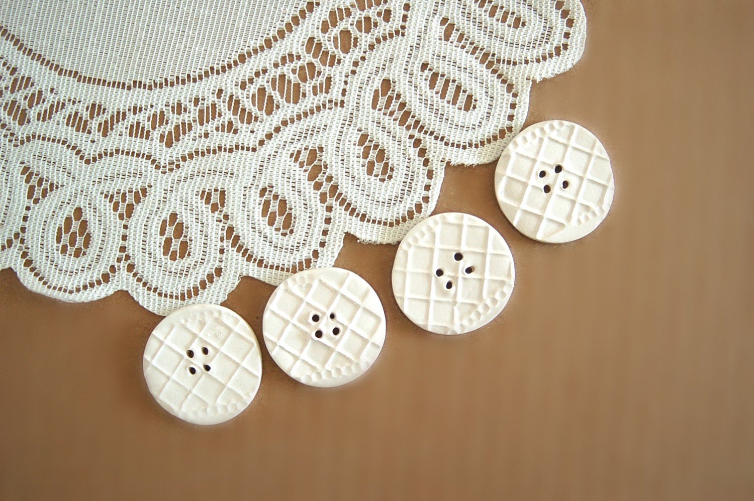 White creamy large imprinted buttons