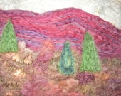 burgundy mountains under a wintery grey sky, a needle felted picture